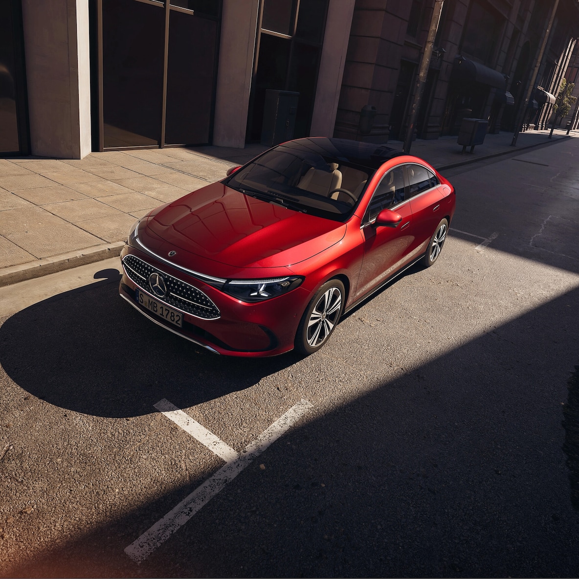 Frontal side view (from a slightly elevated perspective because of the panoramic roof) of the Mercedes-Benz CLA C178 with AMG Line Plus.