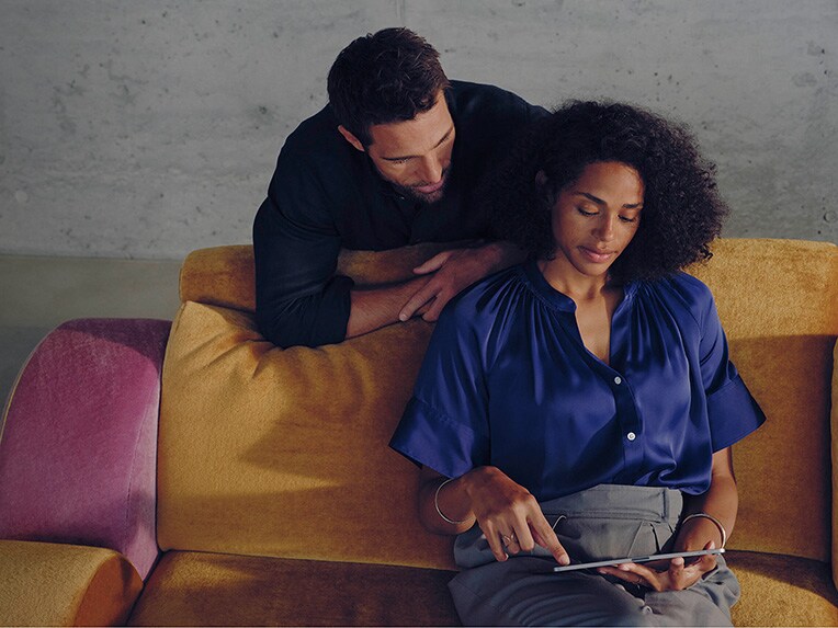 A woman and a man find out about leasing offers.