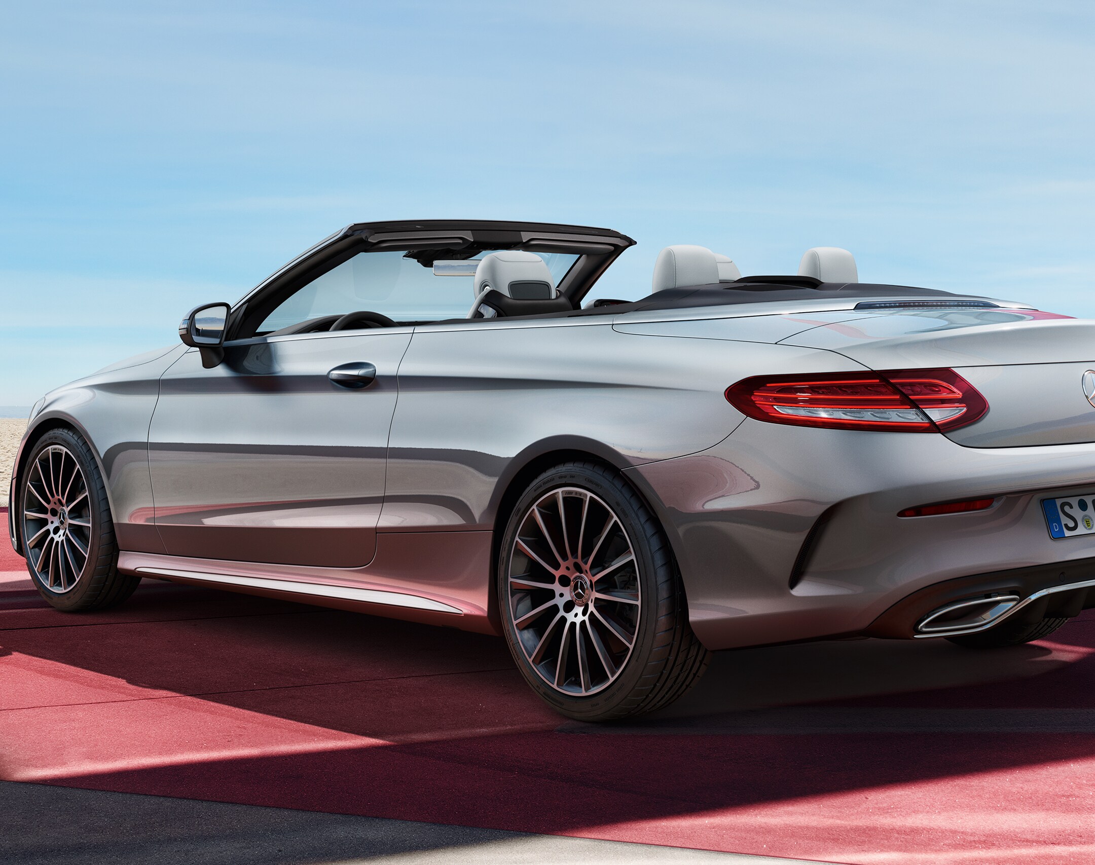 A rear view of the C-Class Cabrio from the side.