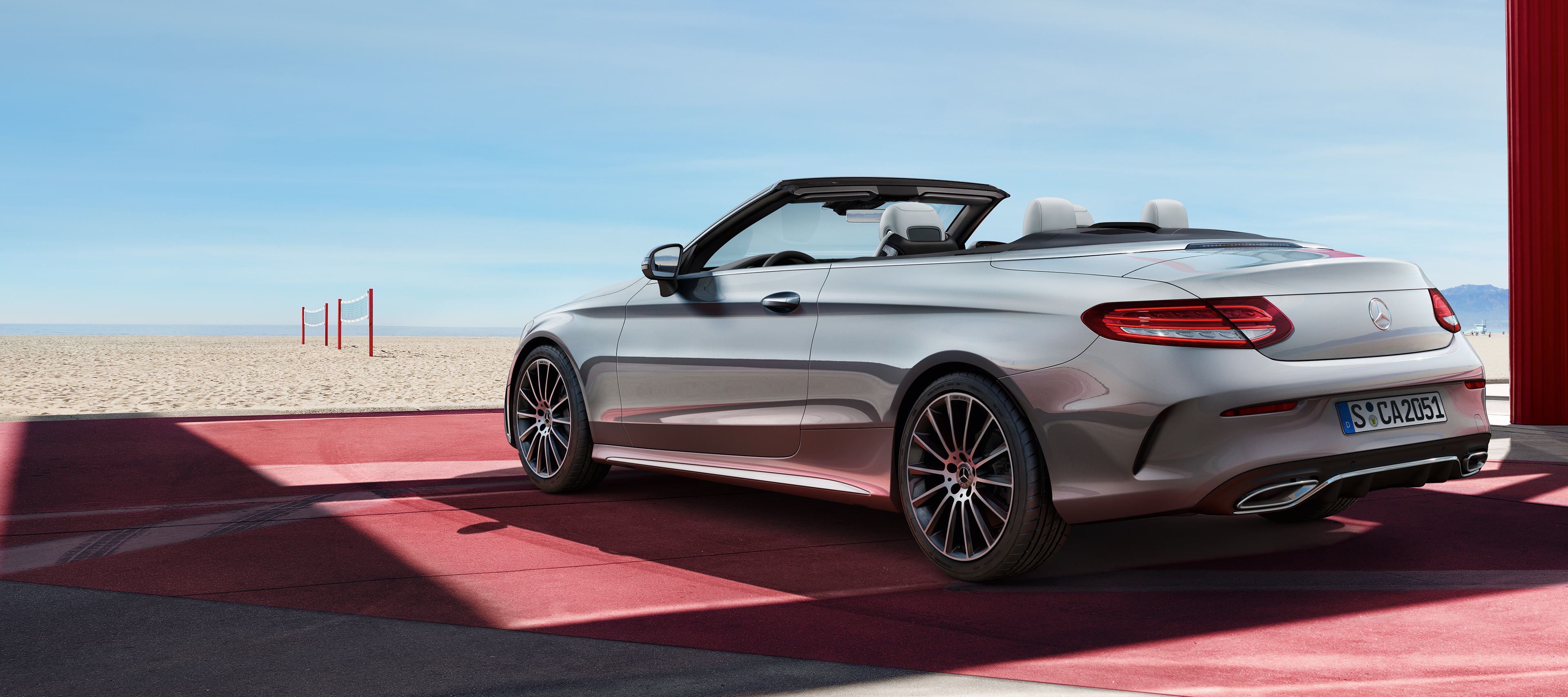 C-Class Cabriolet | Mercedes-Benz A rear view of the C-Class Cabrio from the side.