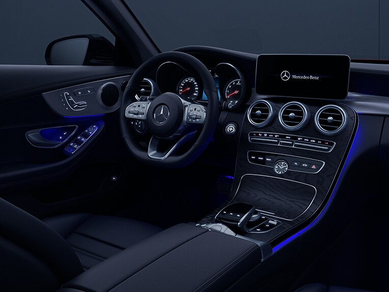 Vehicle interior of the Mercedes-Benz C-Class Cabriolet with ambient lighting.