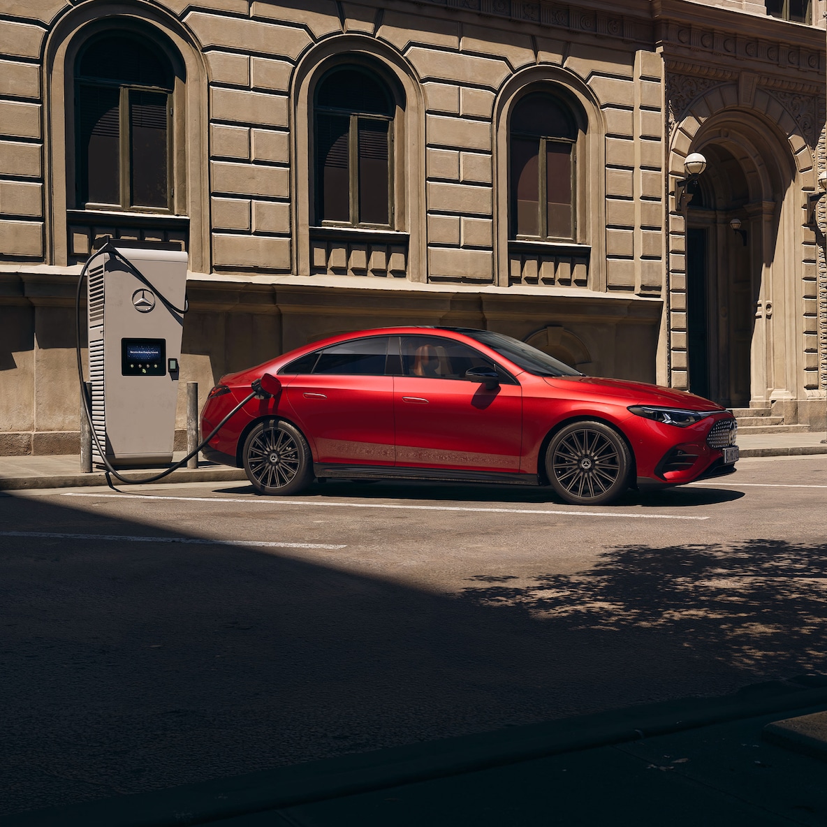 Side view of the Mercedes-Benz CLA C174 at a charging station.