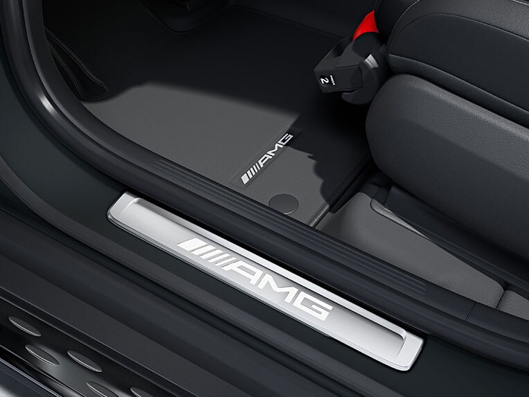 The AMG illuminated door sill panels with "AMG" lettering on the Mercedes-AMG GLC.