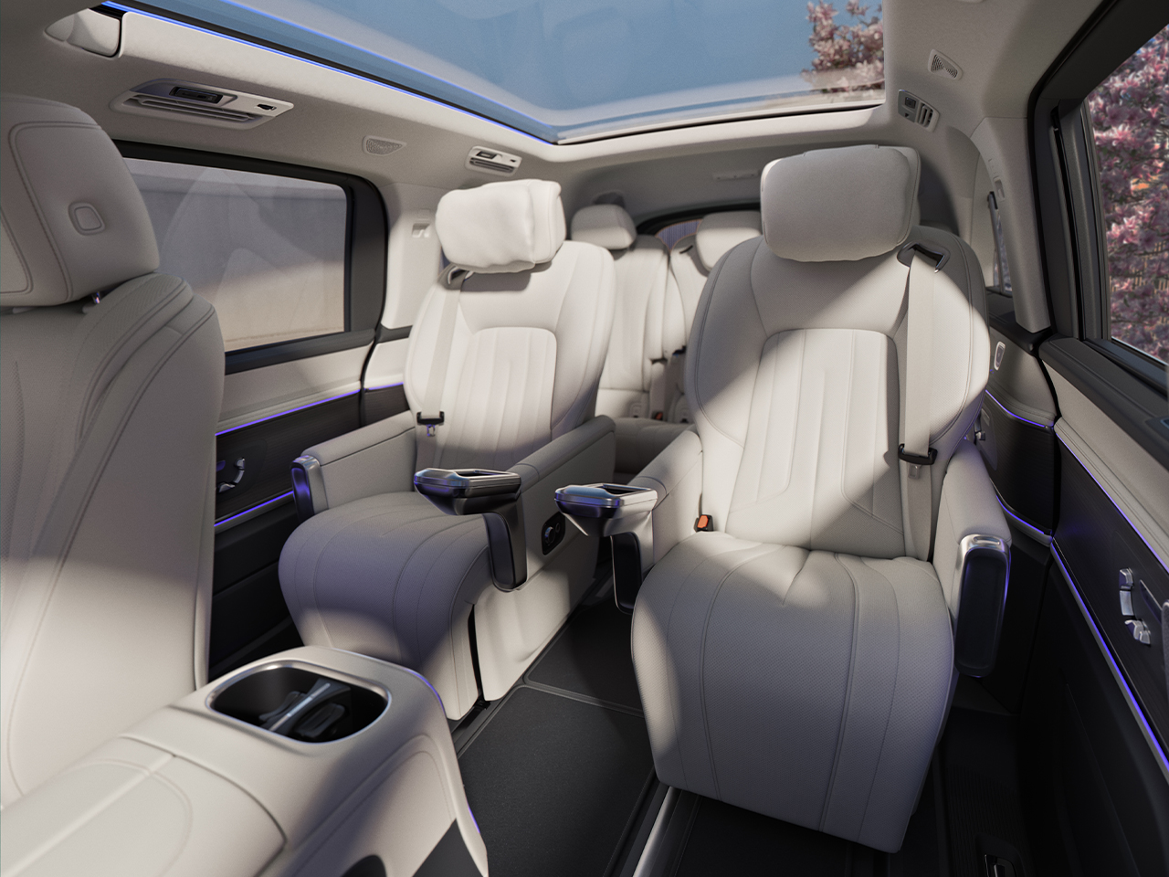 Rear compartment | VLE | Mercedes-Benz The rear compartment with cup holders, folding tables, USB-C ports, a temperature-controlled storage compartment, and storage drawers under the seats.