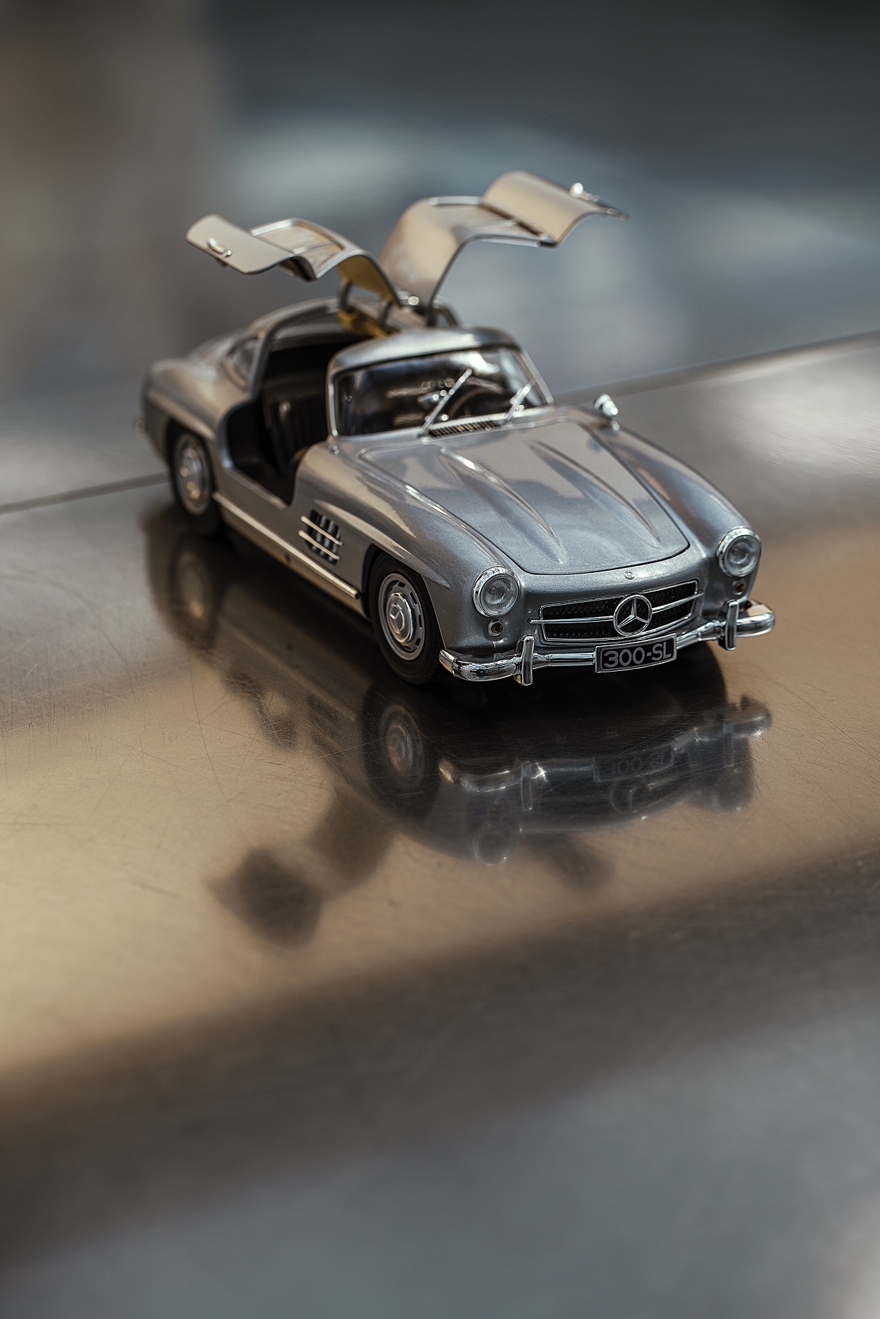 Mercedes-Benz Collection Model Cars | Mercedes-Benz The open gullwing doors of the classic 300 SL model reveal a passion for detail.