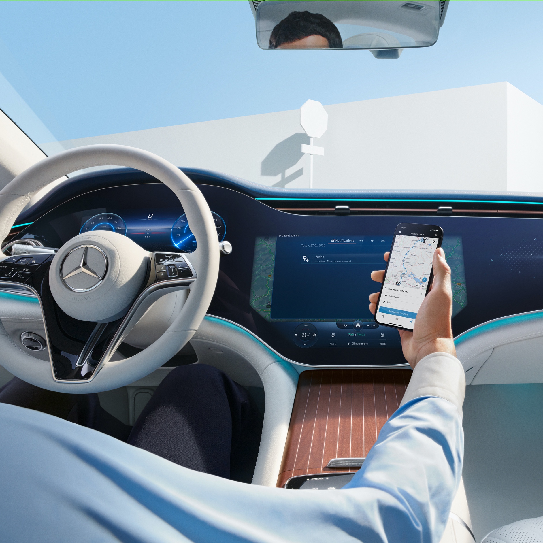 A man transfers the selected route from his smartphone to the MBUX Hyperscreen in his Mercedes-Benz via the Navigation Digital Extras. A man transfers the selected route from his smartphone to the MBUX Hyperscreen in his Mercedes-Benz via the Navigation Digital Extras.