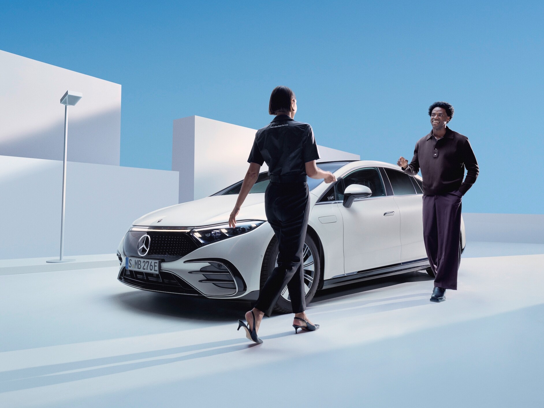 A woman uses the Mercedes-Benz pick-up & return service.