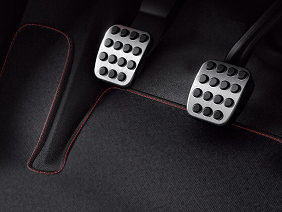 The image shows a floor mat under the pedals in the footwell of a Mercedes.