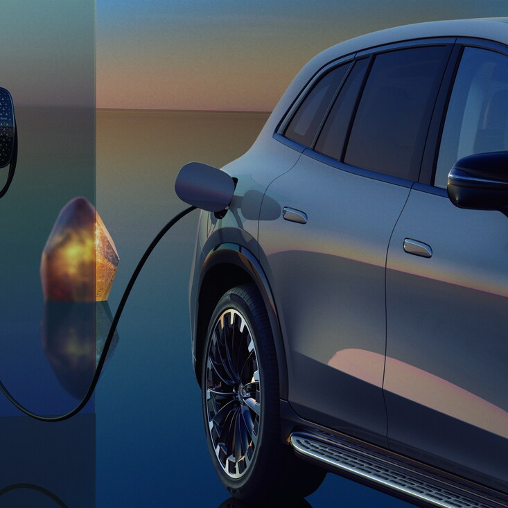 A Mercedes-Benz EQS SUV charging at a Mercedes-Benz Wallbox