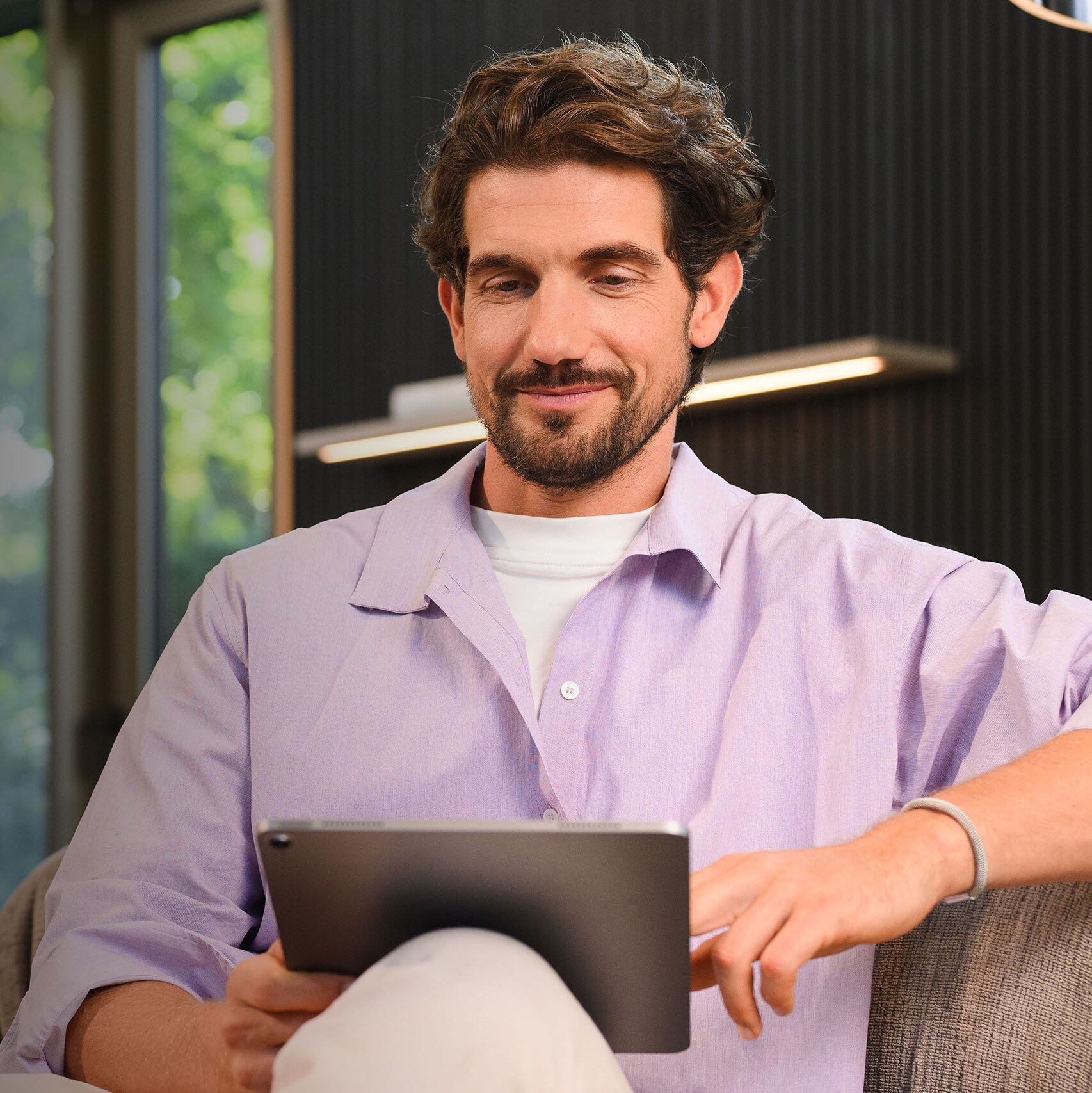 A person sitting and using a mobile device.