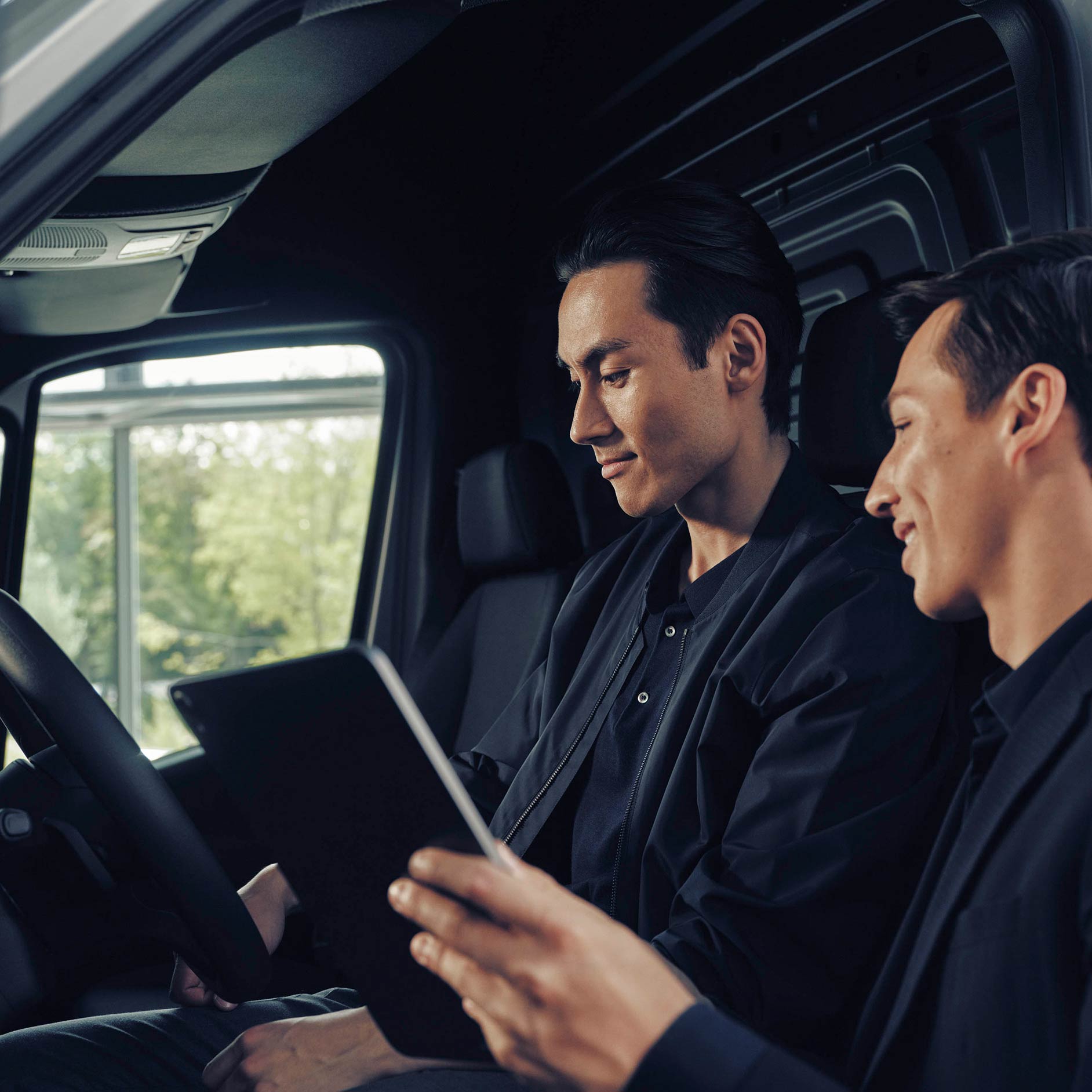 Insurance | Financial Services | Mercedes-Benz Vans A man in conversation with a dealer in a Mercedes-Benz eSprinter van