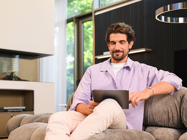 A person sitting and using a mobile device.