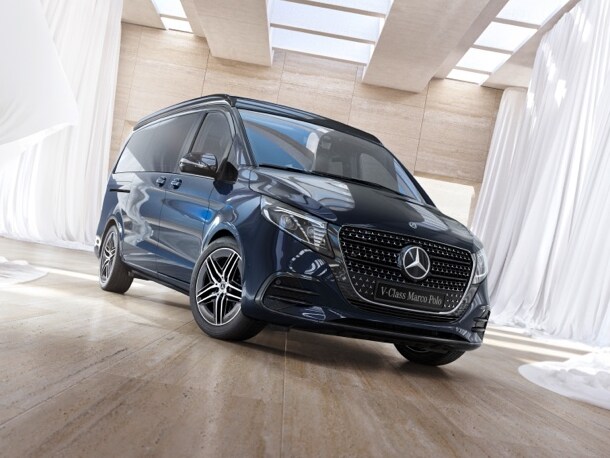 The Marco Polo V-Class from Mercedes-Benz, seen in a brightly illuminated hall surrounded by white curtains.