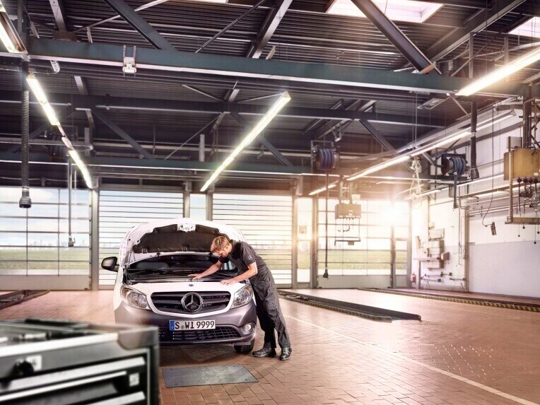 A Mercedes-Benz van being serviced in a Mercedes-Benz Service workshop.