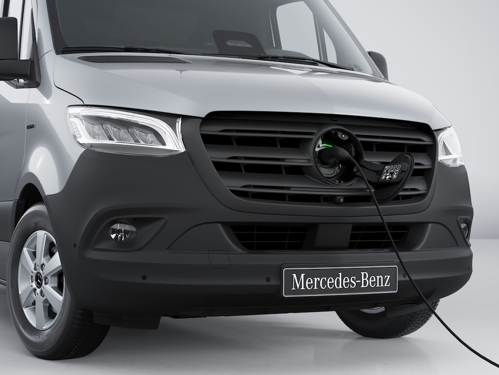The charging socket on the Mercedes-Benz eSprinter Panel Van with plugged-in charging cable.